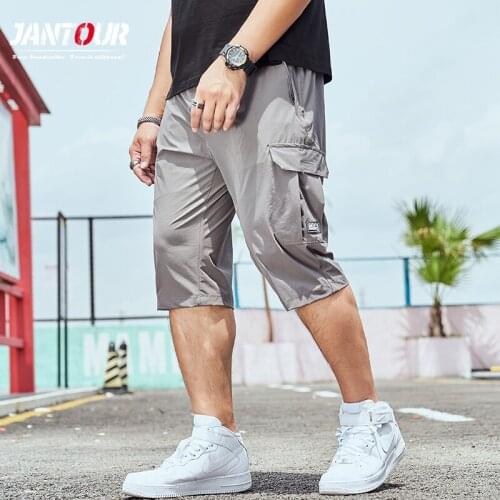 Jantour Brand Summer Thin Mens shorts Pants Loose Straight Beach Pure Pocket Knee-length Quick-drying pants Large Size L-8L