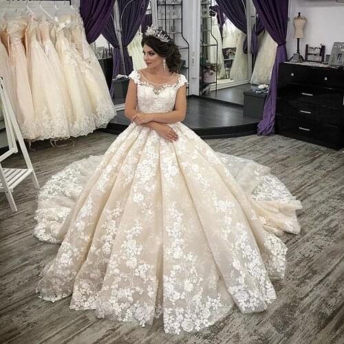Luxury Ball Gown Wedding Dresses Princess Design Cap Sleeve Champagne Tulle Ivory Appliques Lace Bridal Gown Vestido De Noiva