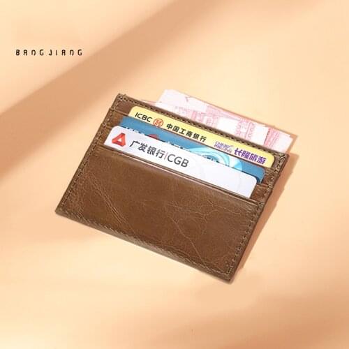Ultra-thin compact card holder genuine leather large capacity mini simple bank card bus holder men and women card holder