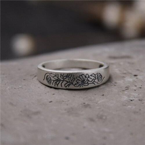 Plum flower ring of carve patterns or designs on woodwork restoring ancient ways is national wind ms Thai silver ring