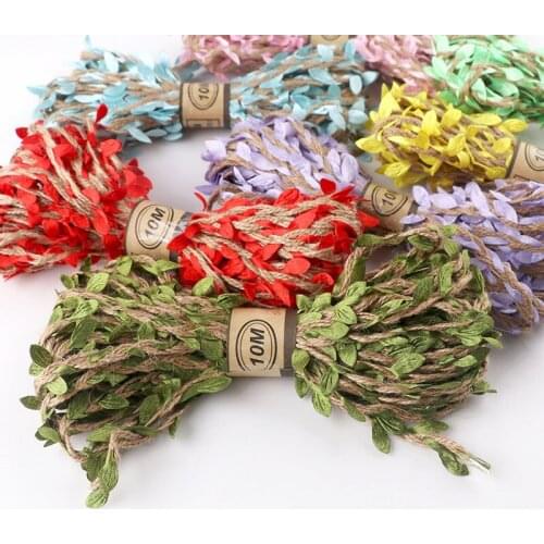 DIY Leaf Rattan Twine To Decorate A Bouquet Of Flowers And Green Leaves. Hand-Made Colorful Rope Tied Flowers With Wrapping Rope