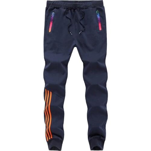 Mens Casual Pants Spring And Autumn Mens Sportswear Running Trousers Male Feet Guard Tether Middle WaistPants