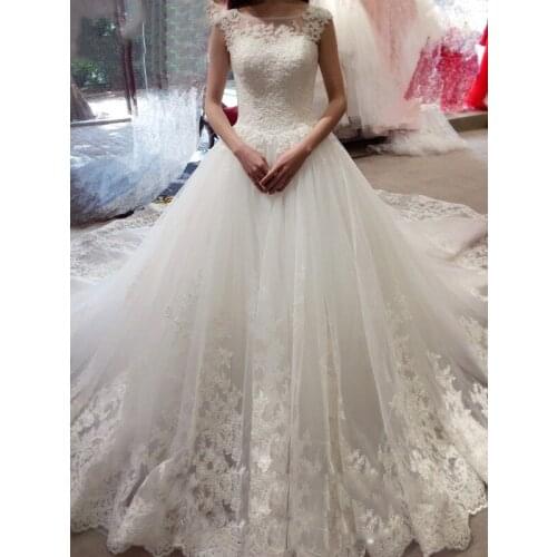 2019 White Tulle Wedding Dresses A-Line Appliques Lace Ball Gowns Sheer Back Sleeveless Bridal Dresses Floor Length