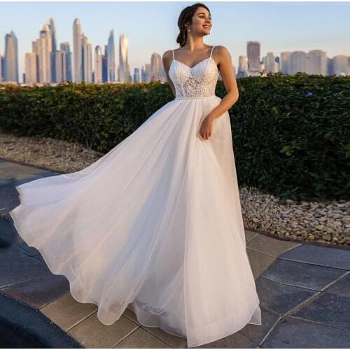 Beach Romantic Wedding Dresses Sweetheart Spaghetti Straps Lace Applique Backless Sweep Train Bridal Gowns Sleeveless A-line New