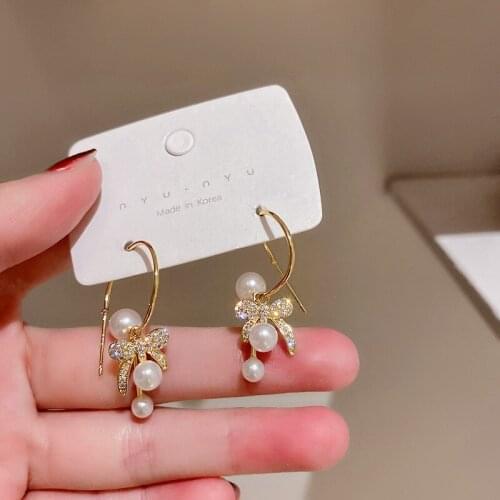 U-Magical Exaggerated Bow-knot Imitation Pearl Cubic Zircon Dangle Earring for Women C Shape Gold Metallic Earring Jewellery