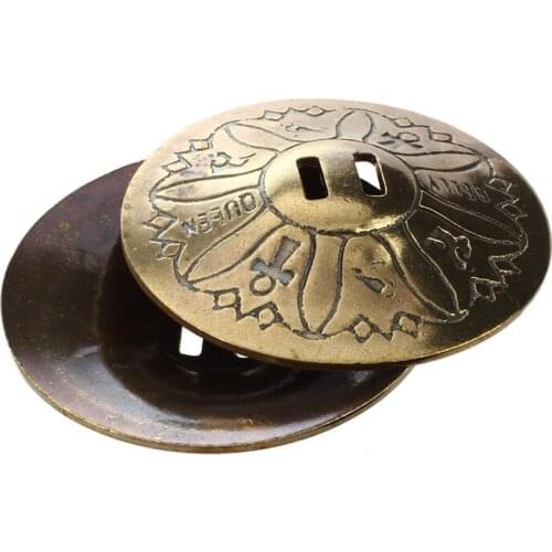 For the belly dance, pair of finger cymbals, in copper, gilded