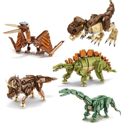 2021 dinosaurs and dinosaur fossils (tyrannosaurus, pterosaur, brontosaurus, stegosaurus, triceratops) boy assembling small buil