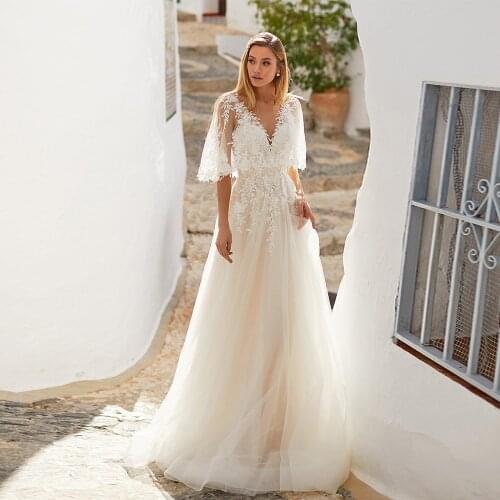 Romantic Boho Wedding Dress Flare Half Sleeves V Neck Lace Applique Tulle Backless A Line Bridal Dress Robe De Mariage