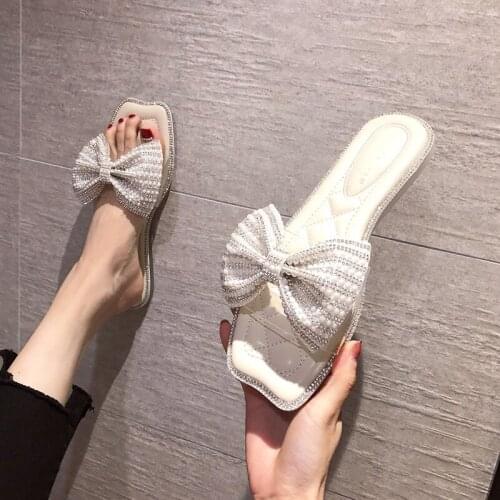 Women/girls pearl bow slippers open toe transparent transparent band flat holiday beach sandals female crystal slides sandalias