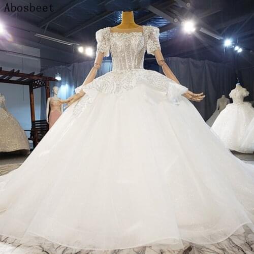 2021 Puff Short Sleeve Ball Gown Wedding Dress with 200CM Cathedral Train See Through Top Fancy Beading Elegant Scoop Bridal