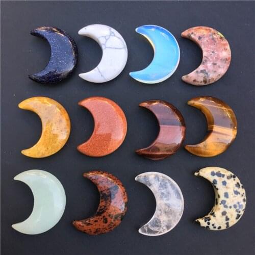 Hand-carved natural crystal moons of different materials for home decorations