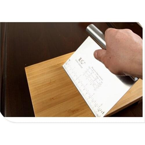 A graduated steel scraper The dough cutter Steel scraper