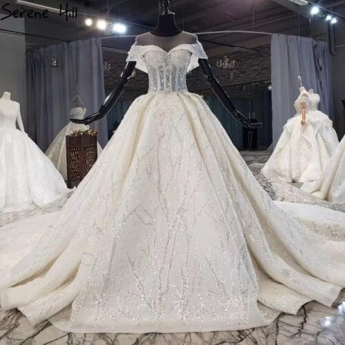 Luxury Dubai Ivory Sleeveless Sexy Wedding Dresses 2020 High-end Sparkle Beading Pearls Bridal Gowns HX0188 Custom Made