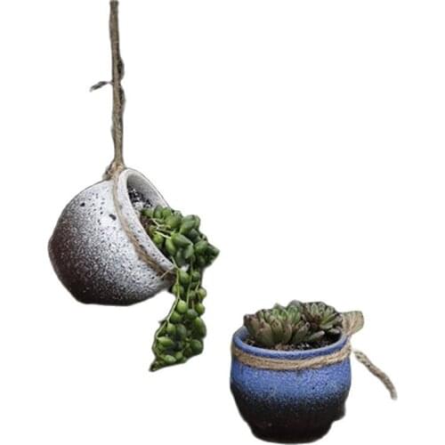 Wall-mounted ceramic hanging basket and flowerpot combination With a variety of random colors of hemp rope hanging on the wall
