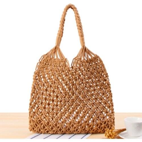 The new solid color shoulder bag school wind female forest series straw hand cotton rope net pocket bag