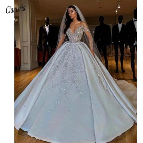 Luxury Long Sleeve Sparkly Beading Crystal Diamond Dubai Saudi Arabic Ball Gown Wedding Dress Illusion V-Neck Bridal Gown