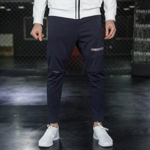 2021 spring and autumn new trousers mens running fitness training sports pants ripped feet casual pants trend