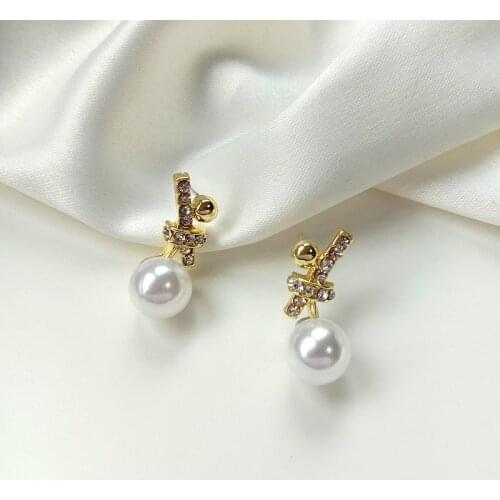 Korean Fashion New Earrings Bowknot Pearl Crystal Temperament Small Knotted Net Red Star Earrings Womens Clothing Wholesale