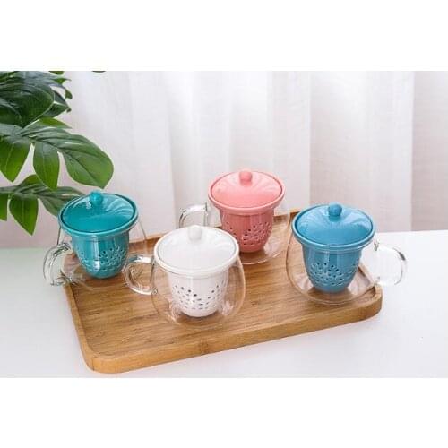 New style of glass comes with a strap that separates and filters the tea for the home coffee cup