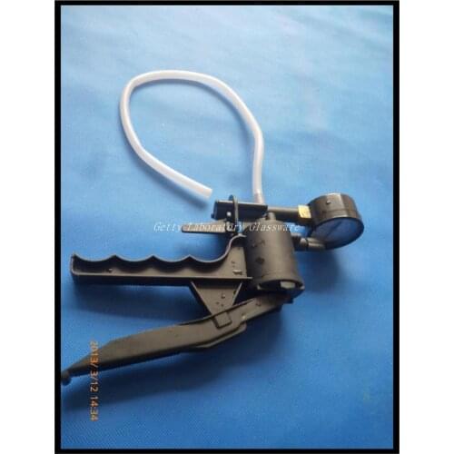 Mini Handheld Vacuum Pump, with gauge displaying in mm HG