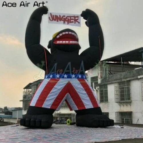 6m High giant Black animal model,standing inflatable gorilla with banner in hands for advertising on France