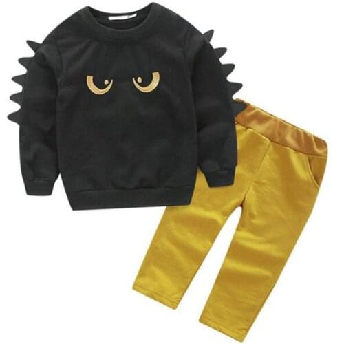 Kids boys clothes set 2017 Autumn 2pcs suit Cartoon black eyes Tops Yellow trend Pants sets Fashion baby clothing