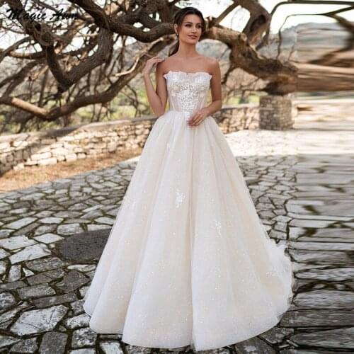 Magic Awn Shiny Champagne Boho Wedding Dresses 2021 Lace Appliques Strapless A-Line Beach Bridal Gowns Lace Up Back Vestido Boda