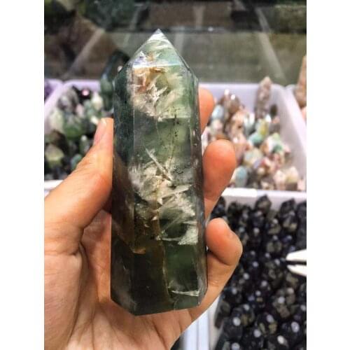 100g，natural fluorite crystal stone, which contains a feather, carved as a single pointed pilliar，tower，houshold furnishings