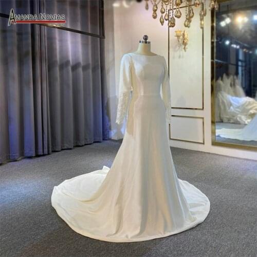 Elegant soft satin wedding dress with long sleeves