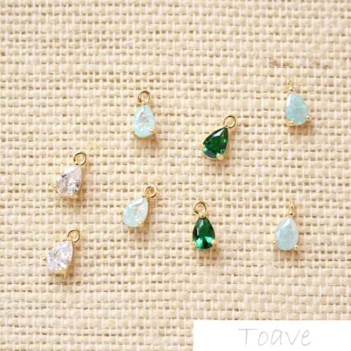 4x9mm 18 K authentic gold zircon droplets deposited on colour-retaining copper