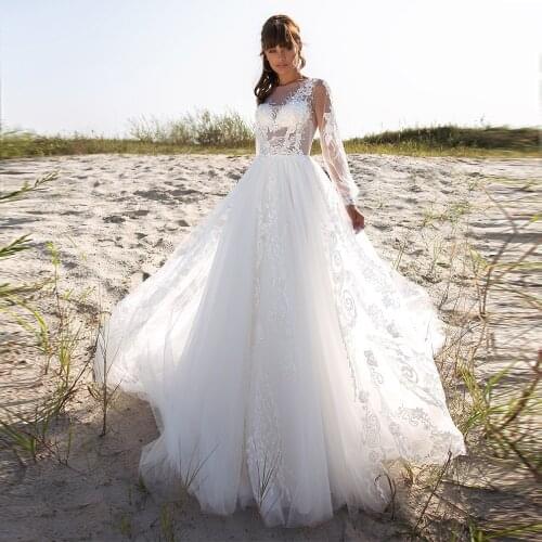 A-Line Tulle Long Sleeve Wedding Dresses 2021 Sheer O-Neck Lace Appliques Sweep Train Boho Beach Bridal Gown With Open Back