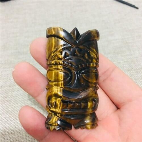 Natural tiger eye stone is carved from the wings of