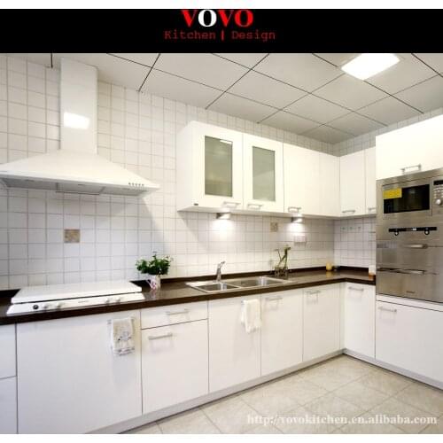 White flat kitchen cabinet with black countertop