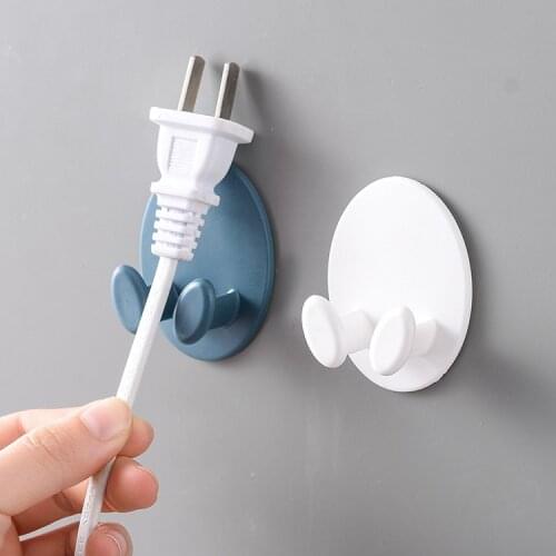 Factory direct sales ellipse plug hook multifunctional plug storage rack line management creative hook new wall hook hanger