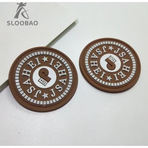 Customized embossed logo PVC rubber patch for clothing with 3D logo Custom silicone sewing tags Private Brand Name for shoes