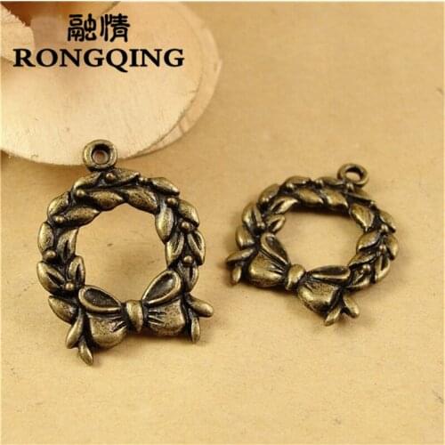 RONGQING 50pcs/lot 24*19MM Bow tie Leaves Bronze Charms handmade Craft pendant making fit DIY for bracelet necklace