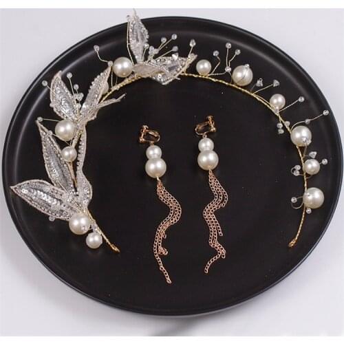 The Brides Handmade Hair Accessorized With Shiny Light Gld Leaf Hairpin Earrings And Wedding Photography Accessories