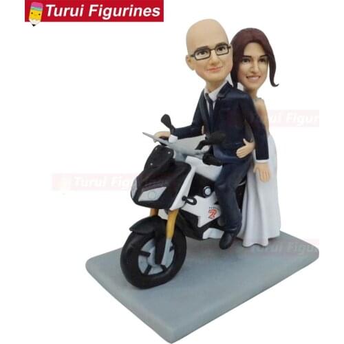 Couple bride groom riding on a motorcycle wedding ceremony cake toppers stands figurines handmade clay dolls