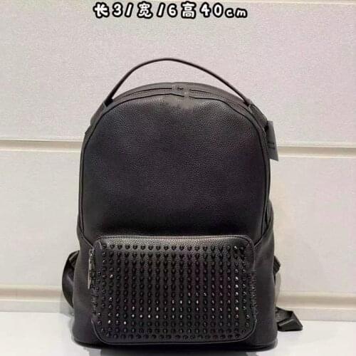 Fashionable European and American leisure leather backpack for men and women personality rivet computer bag for students school