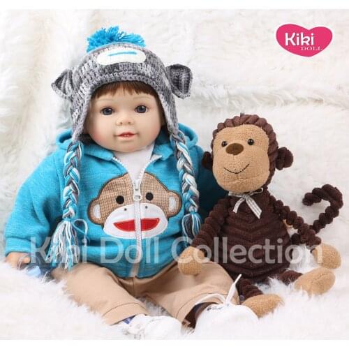 Lifelike Reborn Baby Doll 22 Inch Soft Realistic Silicone Vinyl Limbs and Cotton Body Children Gift Set with Monkey Toy