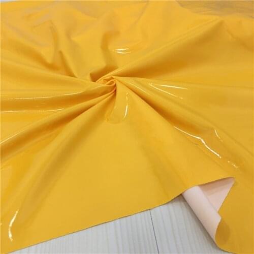 140cm*100cm Bright yellow smooth mirror leather high stretch knitted leather fabric four-sided stretch PU fabric quality