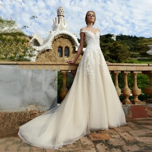 Sexy Sheer Neck Applique Lace Wedding Dress With Cap Sleeves Keyhole Back Sweep Train Tulle A-line Wedding Gowns robe de mariage