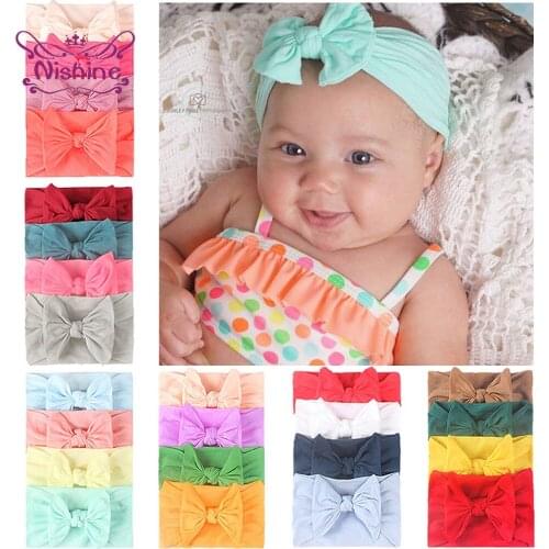 Nishine 4pcs/lot Fashion Handmade Knotted Elastic Infant Hairband Solid Color Bowknot Nylon Headband Bows Headwear Photo Props