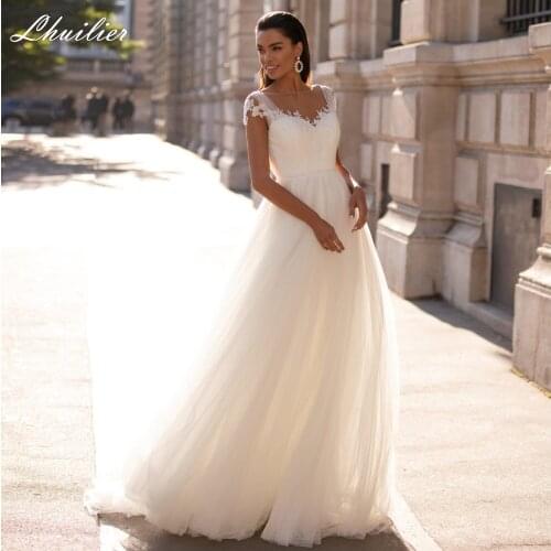 Lhuilier A-line Beach Tulle Wedding Dresses 2020 Scoop Neck Cap Sleeves Floor Length Backless Court Train Bridal Dress