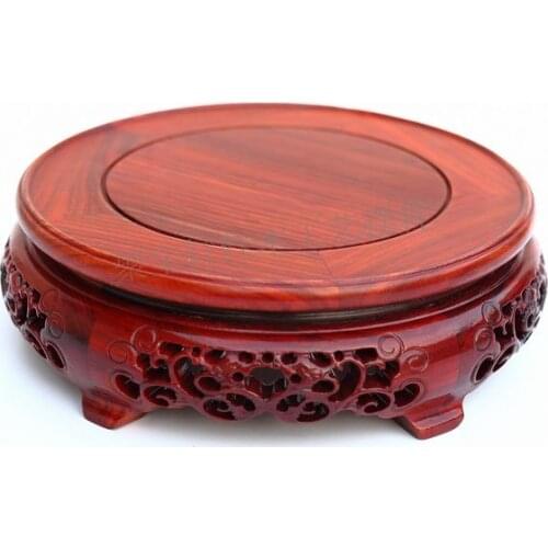 Red wingceltis of solid wood carving round base household act the role ofing is tasted annatto handicraft furnishing articles