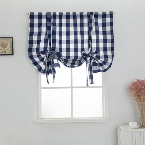 Cilected Roman Blinds On The Windows