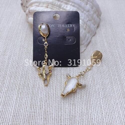 Simple temperament long style pearl cattle head earrings personality 100 match tassel earrings European and American female