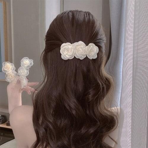 In the summer of 2021, the new camellia top clip super fairy temperament clip hairpin female joker head jewelry