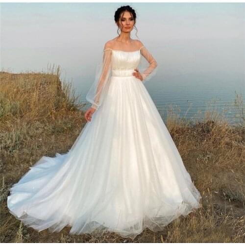 Bohemian Wedding Dress 2021 Sheer Boat Neck Illusion Tulle Shiny Long Lantern Sleeve Sweep Train Bride Gown Robe de Mariee