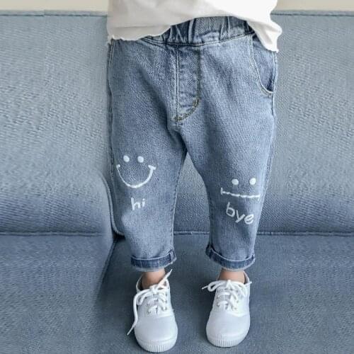 Spring and autumn girls' new Korean style trousers, childrens casual all-match jeans, smiley printed pants for 3 to 7 years